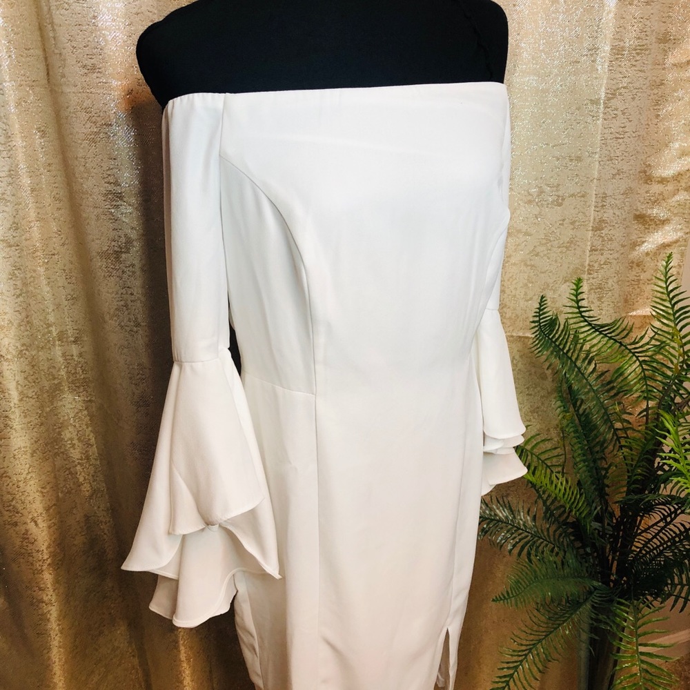 White off shoulder dress. Bell sleeves.